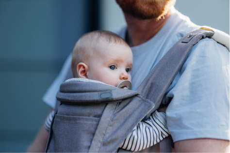 Father carrying baby in baby carrier